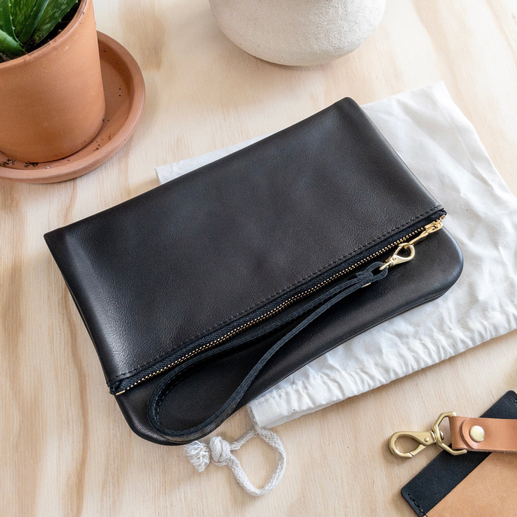 Hides in Hand Bag - Fold Over Purse - Black – Authentique Gift Shop